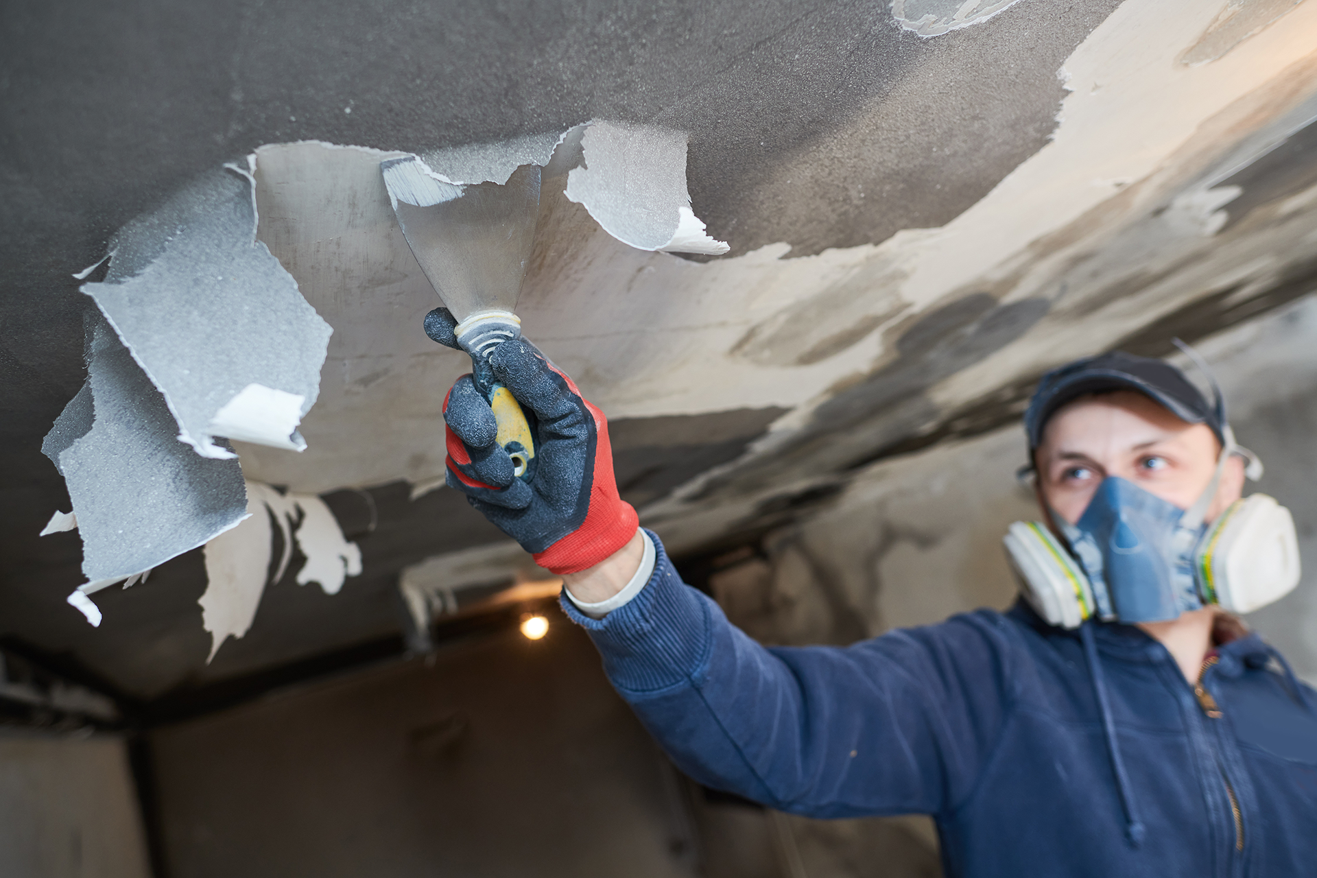 Restoration crew repairing fire-damaged home